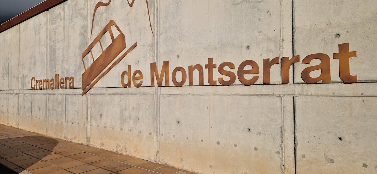 Montserrat rack railway station sign on the concrete wall at Cremallera de Montserrat