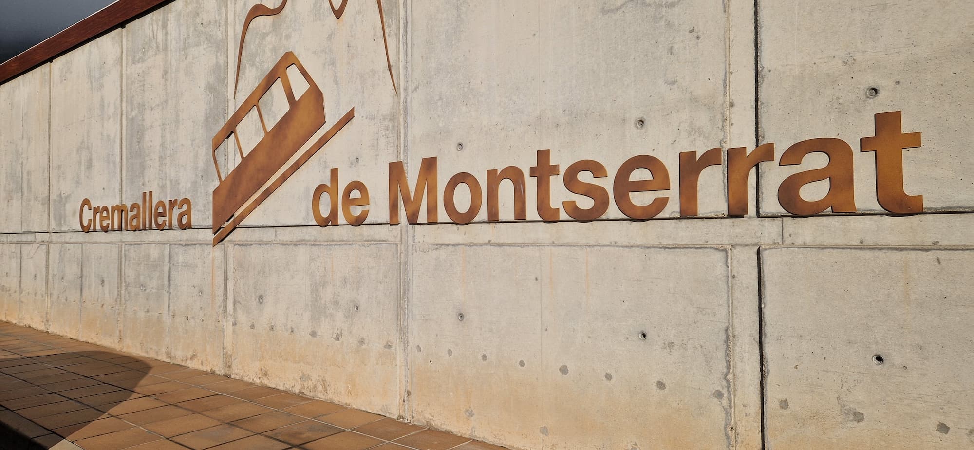 Cremallera de Montserrat station sign in Monistrol