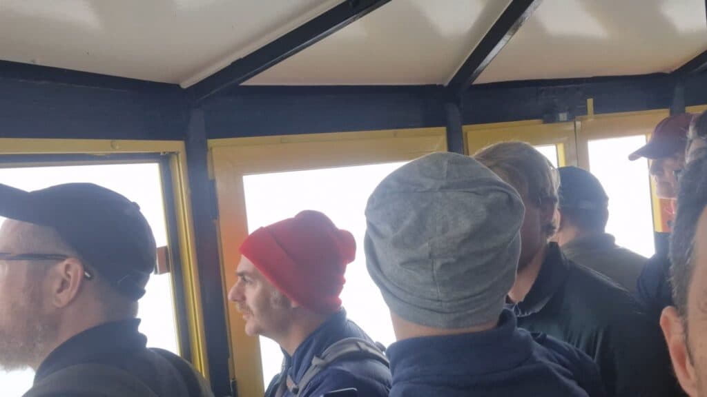 Crowded interior of the Montserrat cable car during the ascent