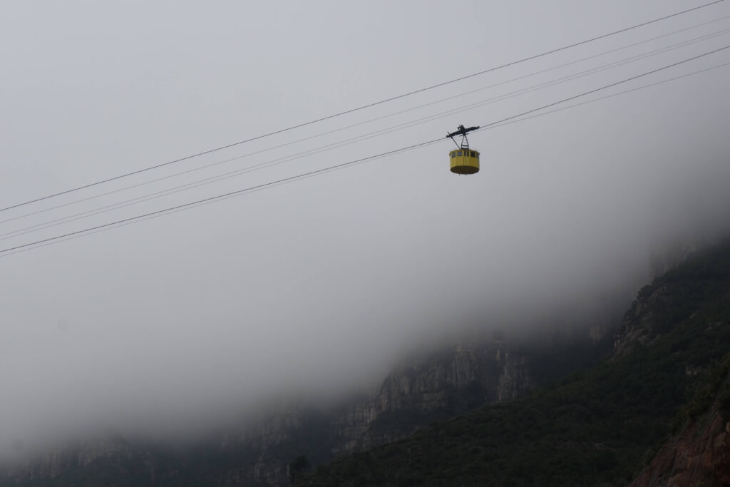 Montserrat cable car descending through fog