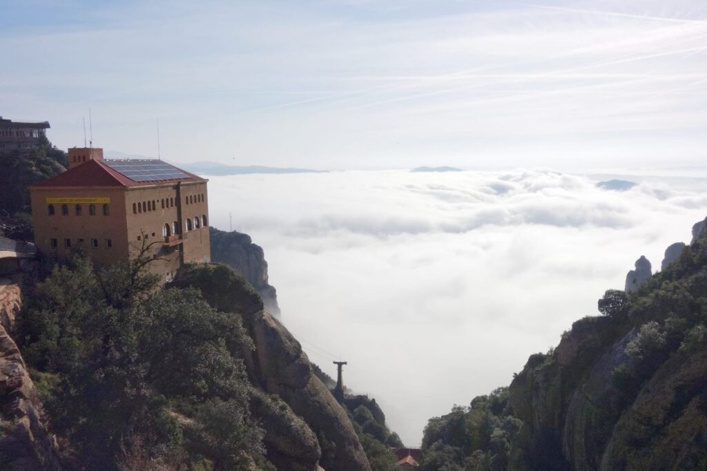 Clouds moving through the Montserrat cliffs near the upper cable car station