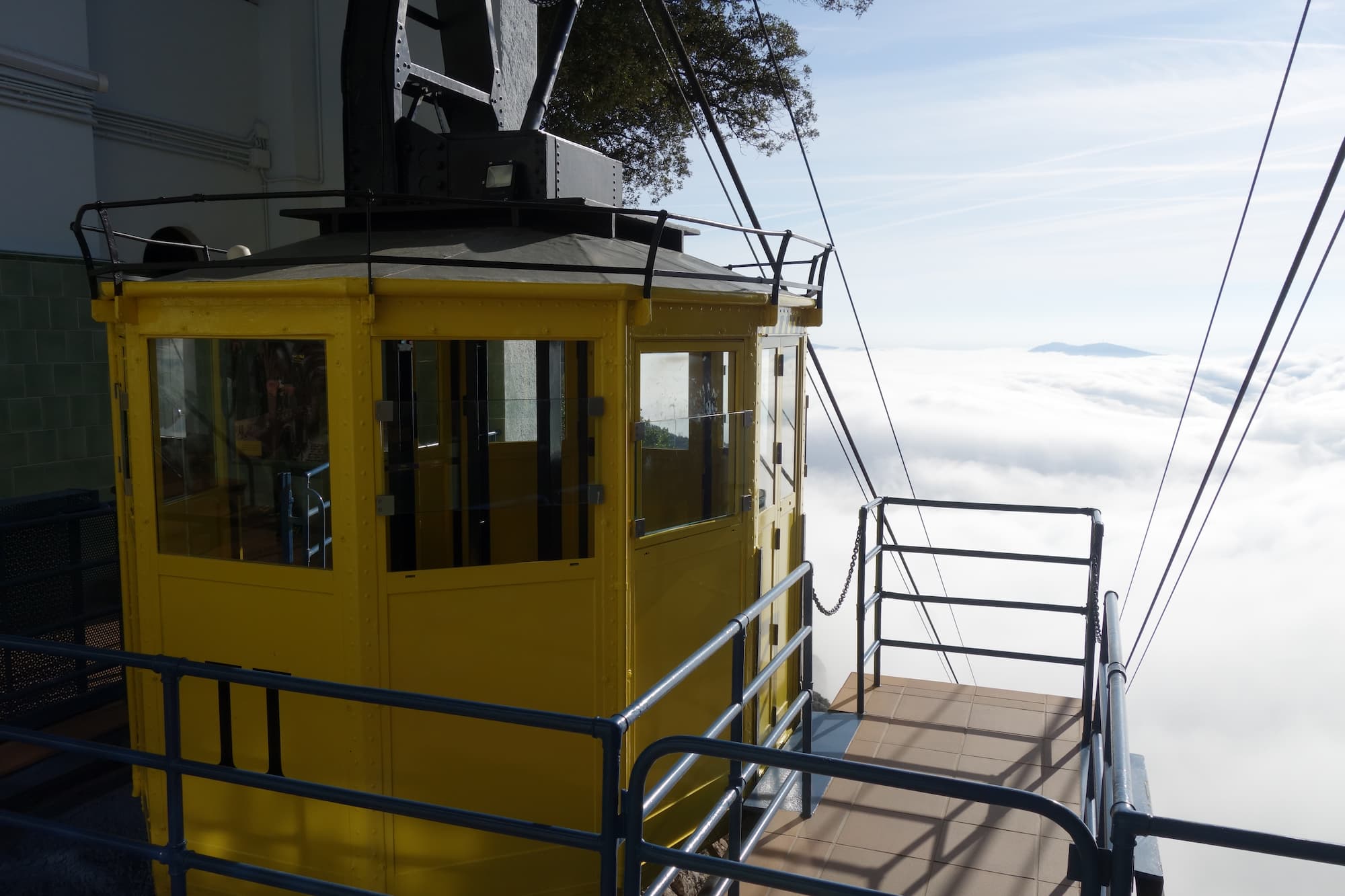 Montserrat Cable Car (Aeri de Montserrat) above a sea of clouds seen from the upper station