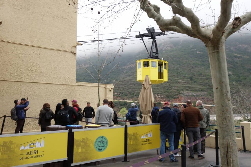 Tourists waiting at the lower station of the Aeri de Montserrat cable car
