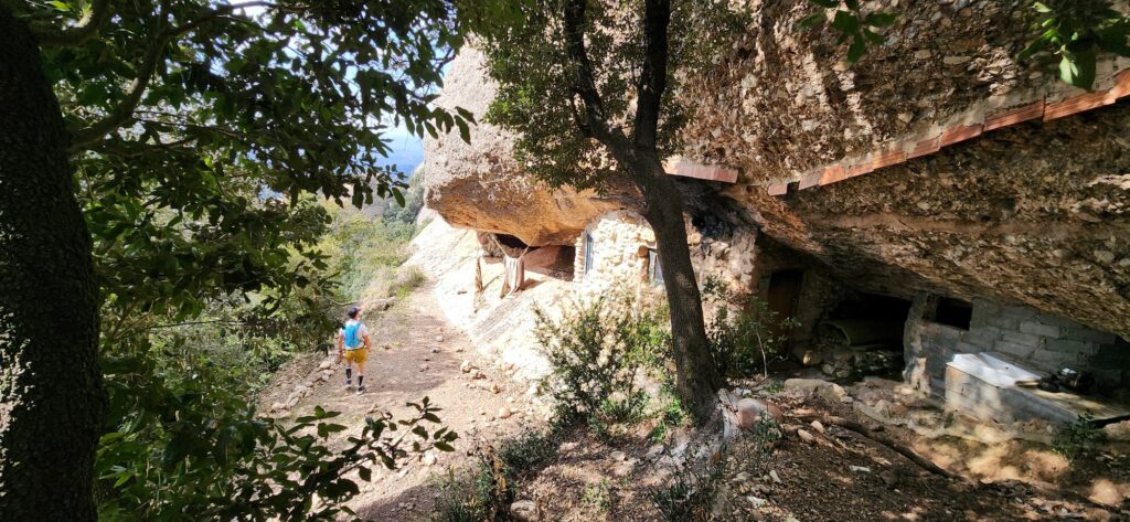 Sant Martí shelter in Montserrat carved into rock along hiking trail near Miranda de la Magdalena