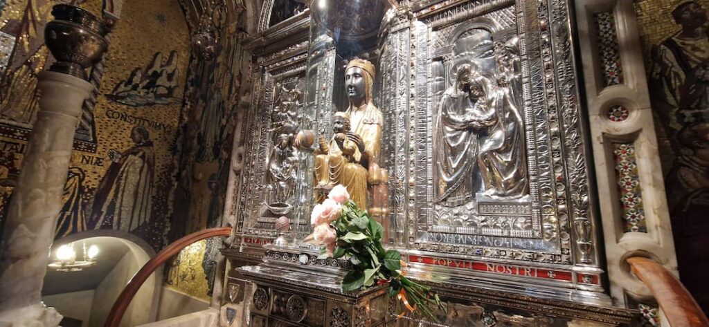 Black Madonna Montserrat fertility symbol with Child Jesus holding a pine cone