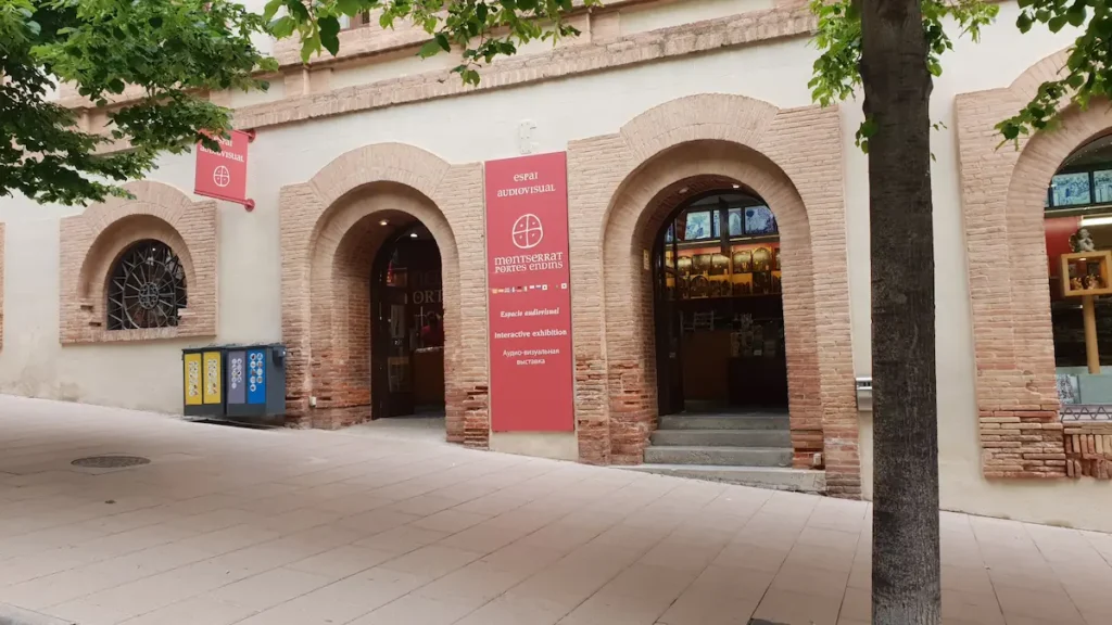 Audiovisual Space Montserrat Audiovisual Space step-free entrance under the Portes Endins banner in the monastery arcade