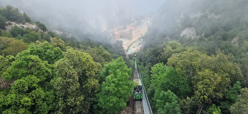 Sant Joan funicular climbing towards the upper station, with Montserrat monastery below