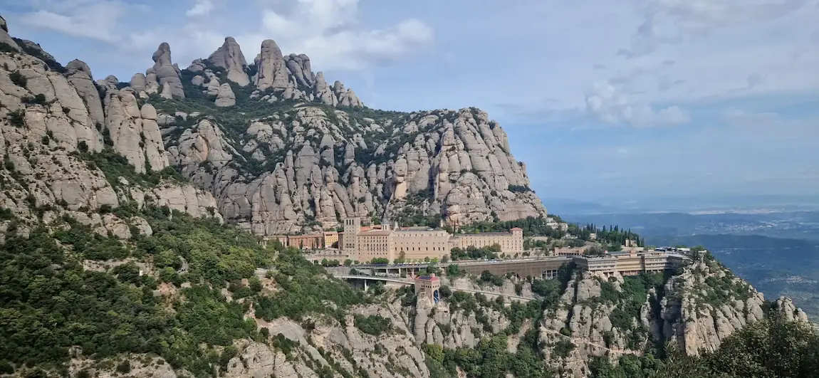 Montserrat monastery below the conglomerate peaks, seen from Sant Miquel